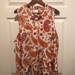 Sleeveless blouse with cutout neck.  2X